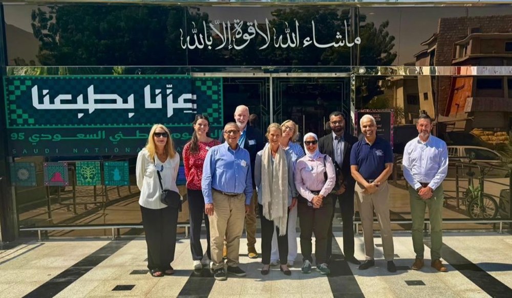 A group of people outside an exhibition hall in Saudi Arabia